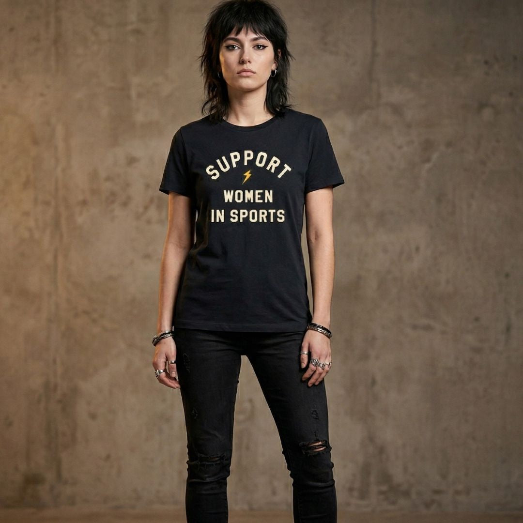 Woman wearing a black t-shirt with 'Support Women in Sports' text against a textured brown background